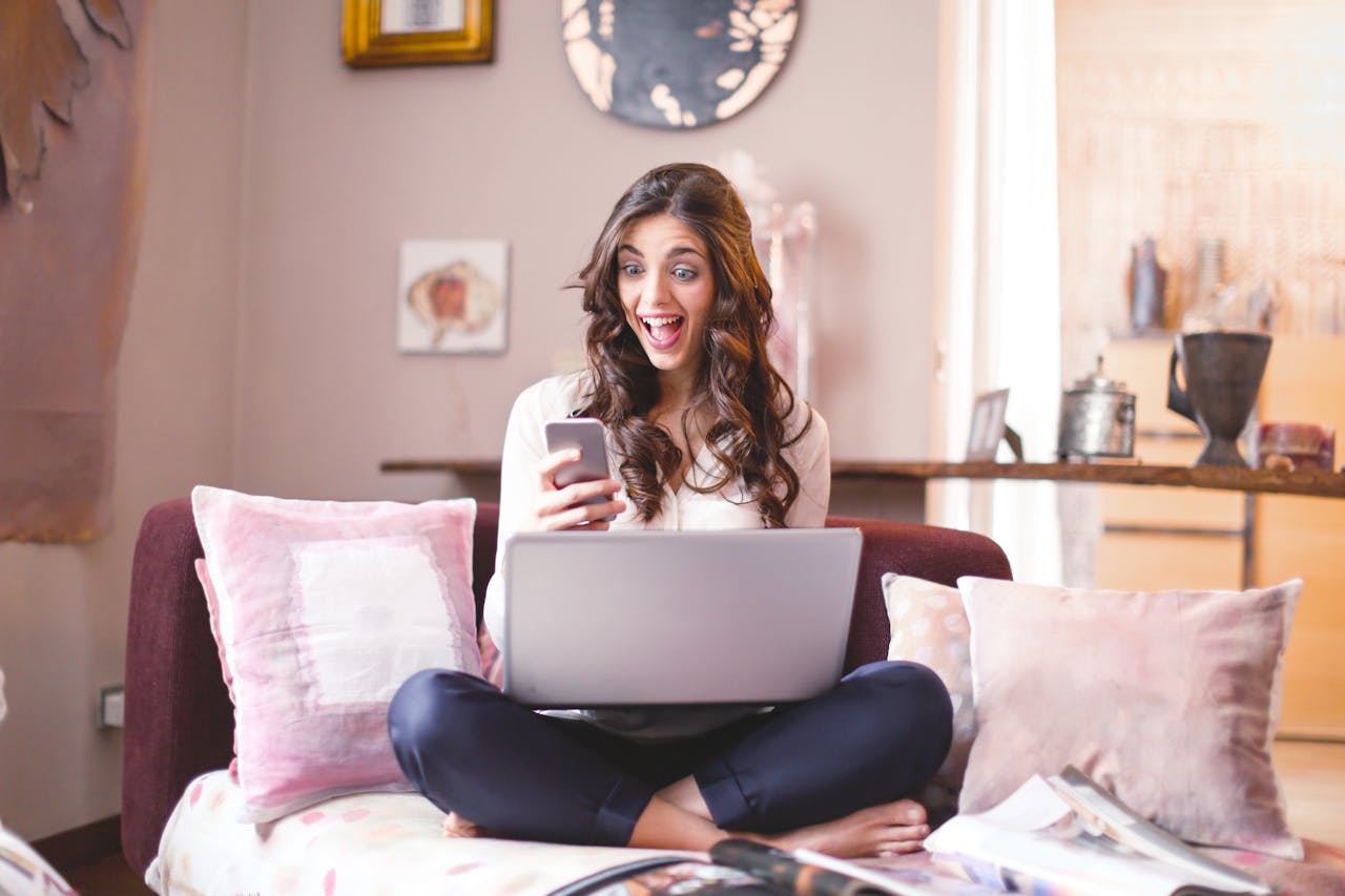 woman with laptop and cellphone