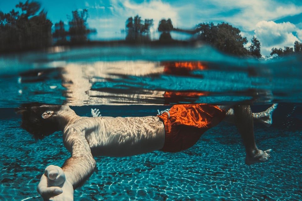 Man swimming in pool
